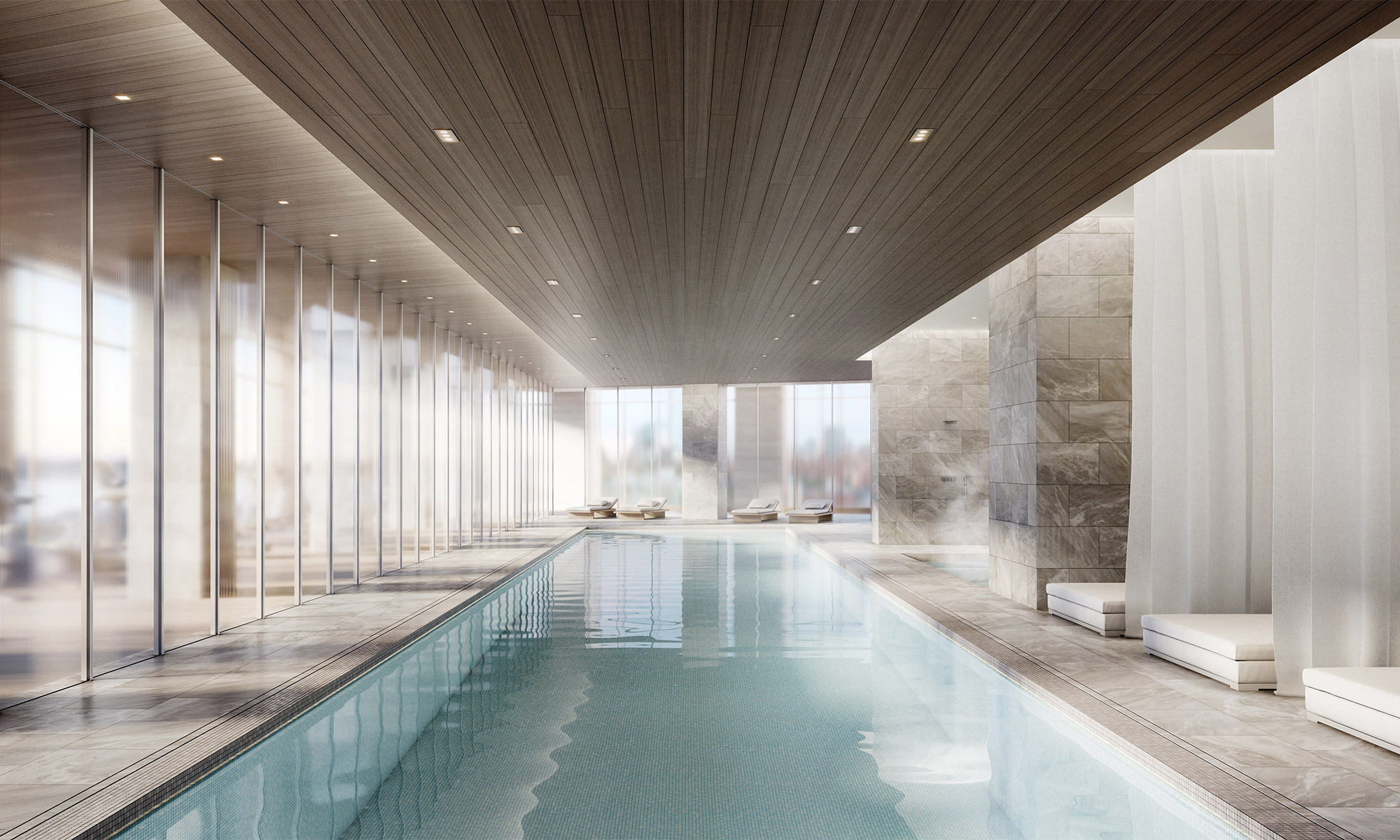 Long indoor pool with marble flooring and wood paneled ceiling