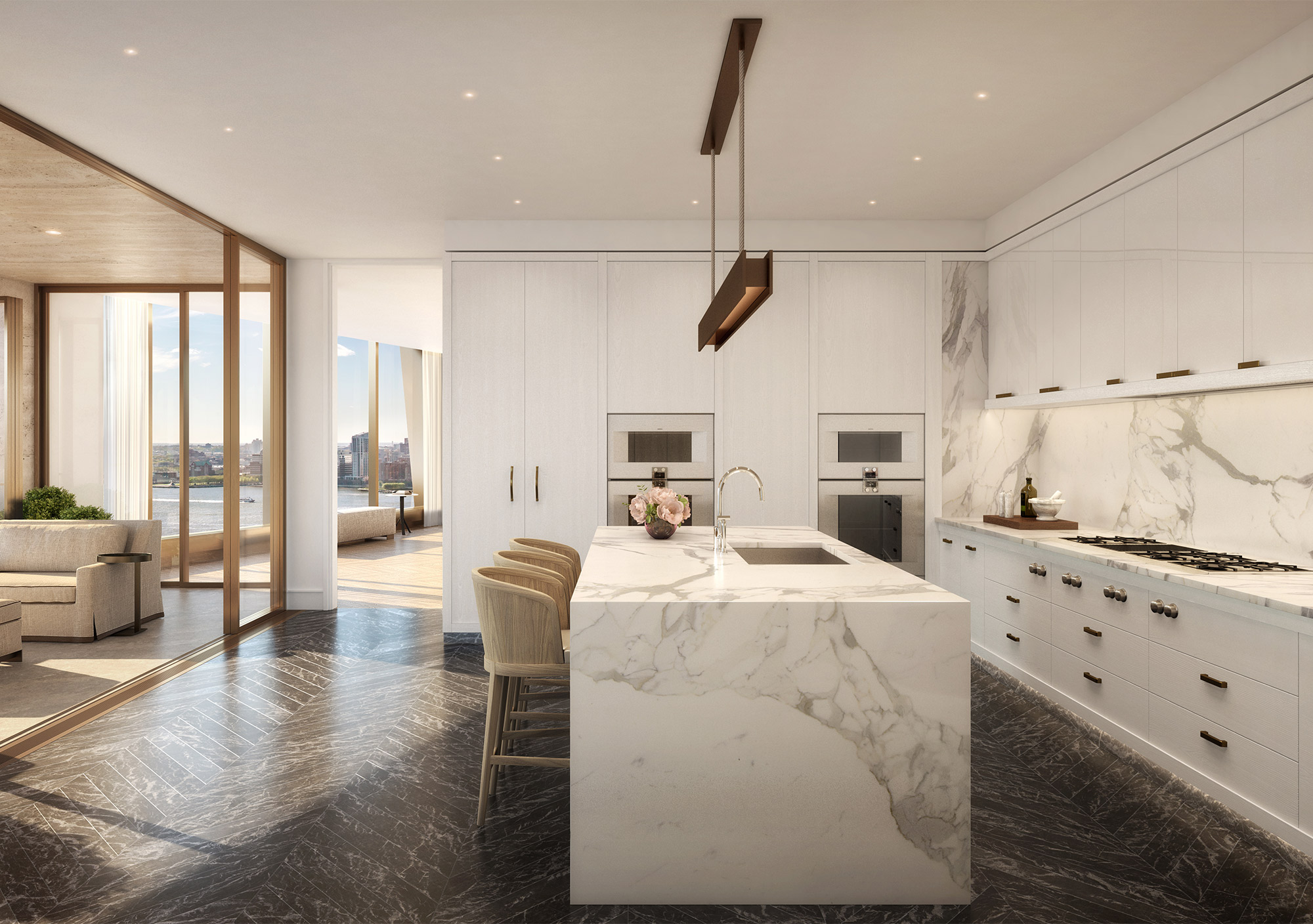 Marble island in kitchen with white cabinets