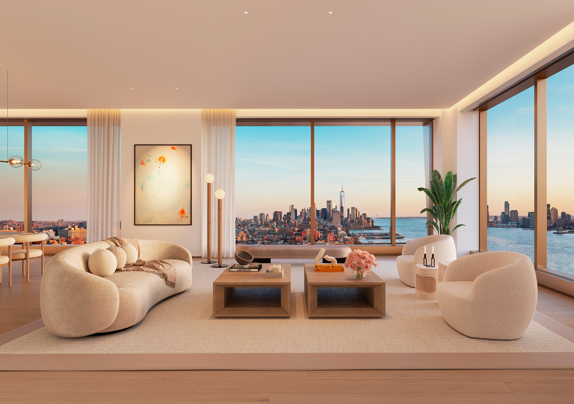 Luxurious living room with creme furniture overlooking Hudson River and skyline