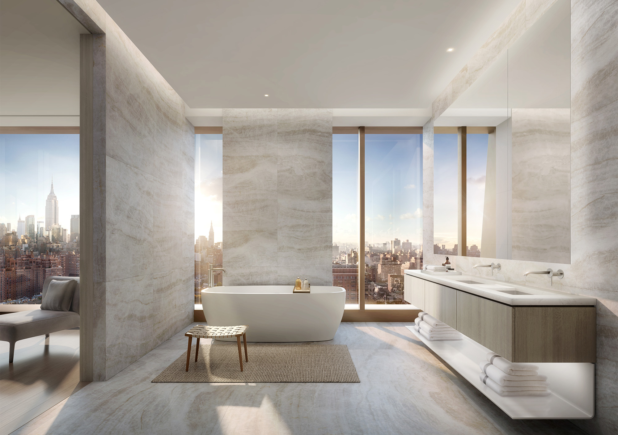 Luxurious bathroom with bathtub and floor to ceiling windows, overlooking the city